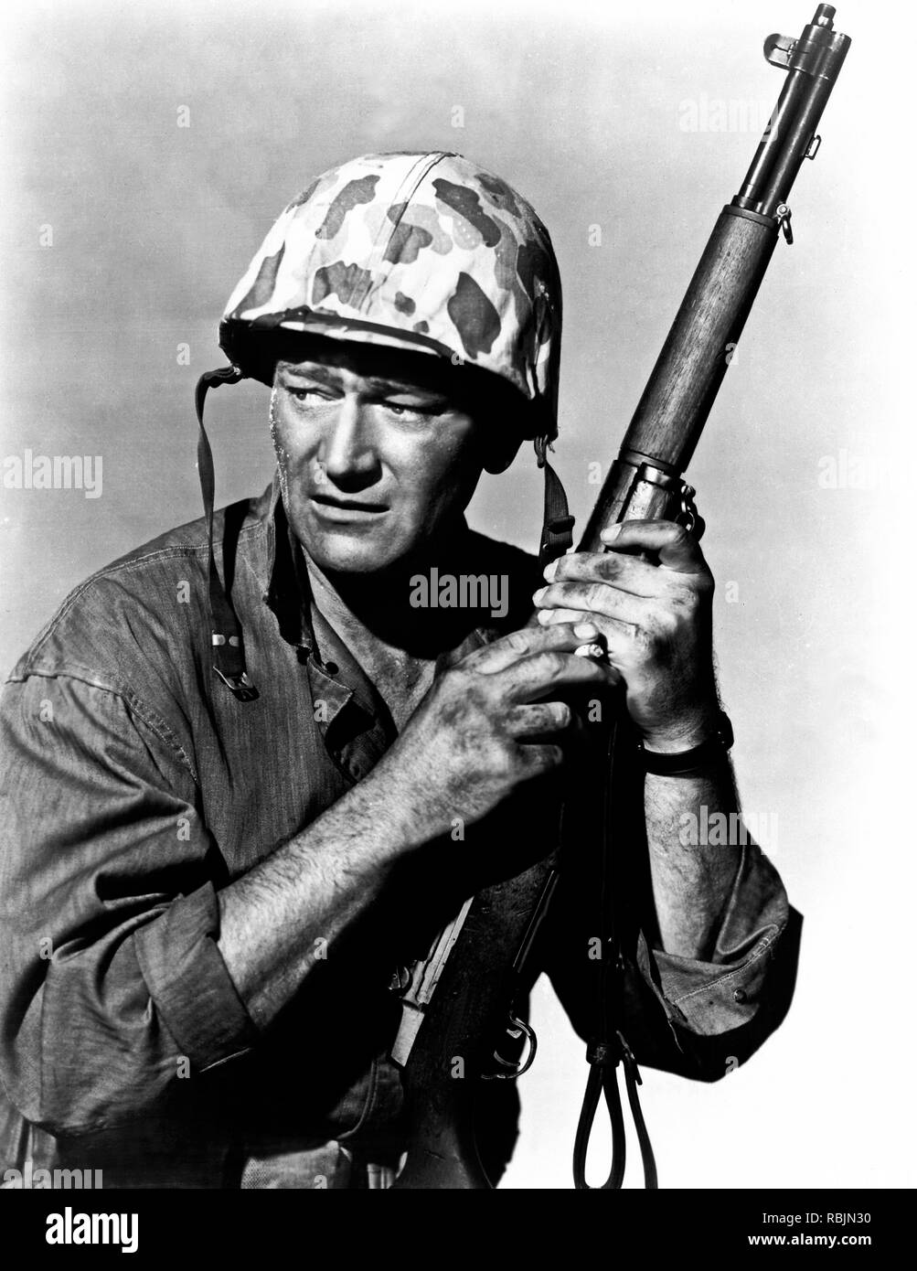 Sands of Iwo Jima is a 1949 war film starring John Wayne that follows a group of United States Marines from training to the Battle of Iwo Jima during World War II. The film also features John Agar, Adele Mara and Forrest Tucker, was written by Harry Brown and James Edward Grant, and directed by Allan Dwan. The picture was a Republic Pictures production. Credit: Hollywood Photo Archive / MediaPunch Stock Photo
