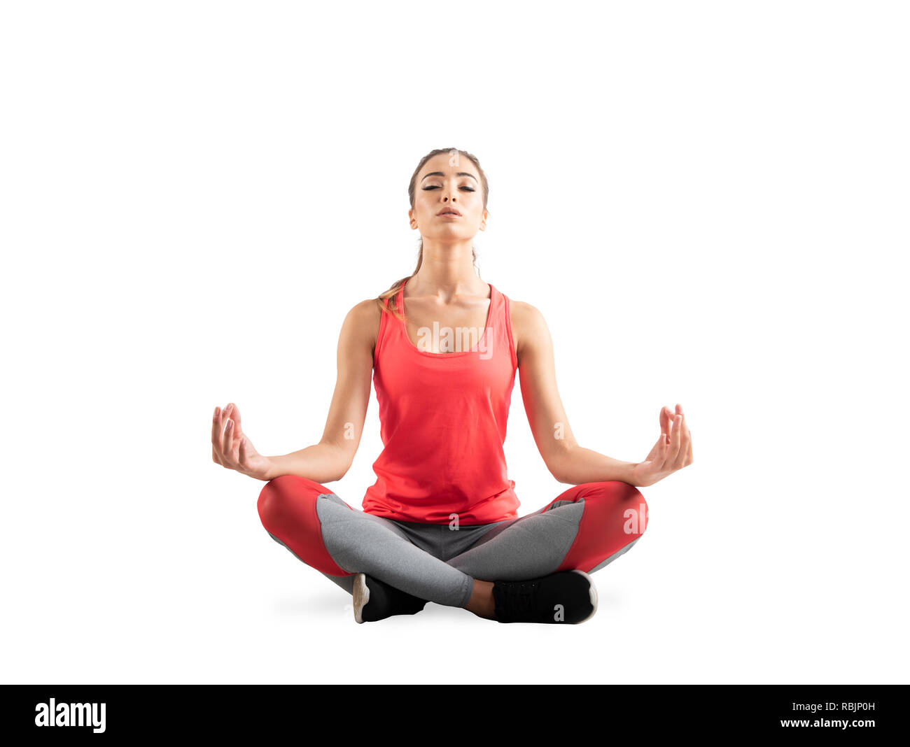 Young girl relaxing in yoga position. Isolated on white background Stock Photo