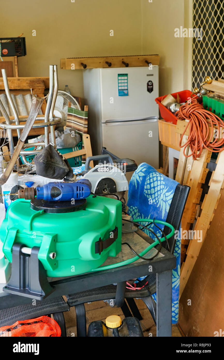 Pile of random objects at a hoarders back patio / Compulsive hoarding Stock Photo