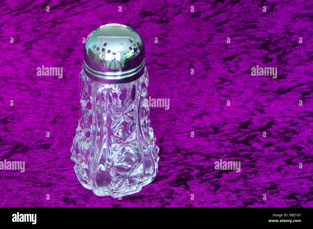 Cut Glass Crystal Sugar Shaker with Silver Plated Top Stock Photo