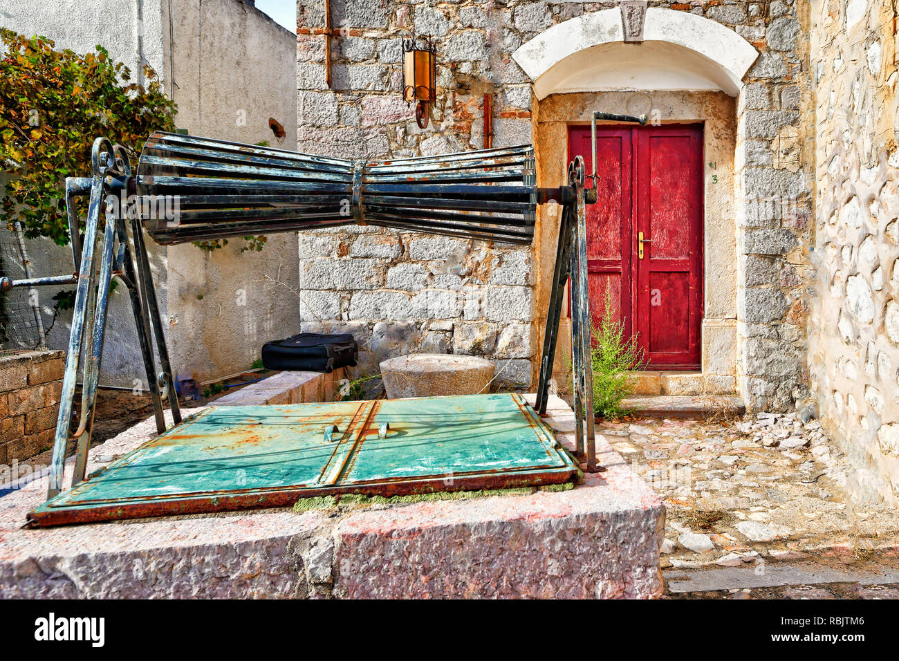 Abandoned traditional well in the medieval mastic village of Vessa on