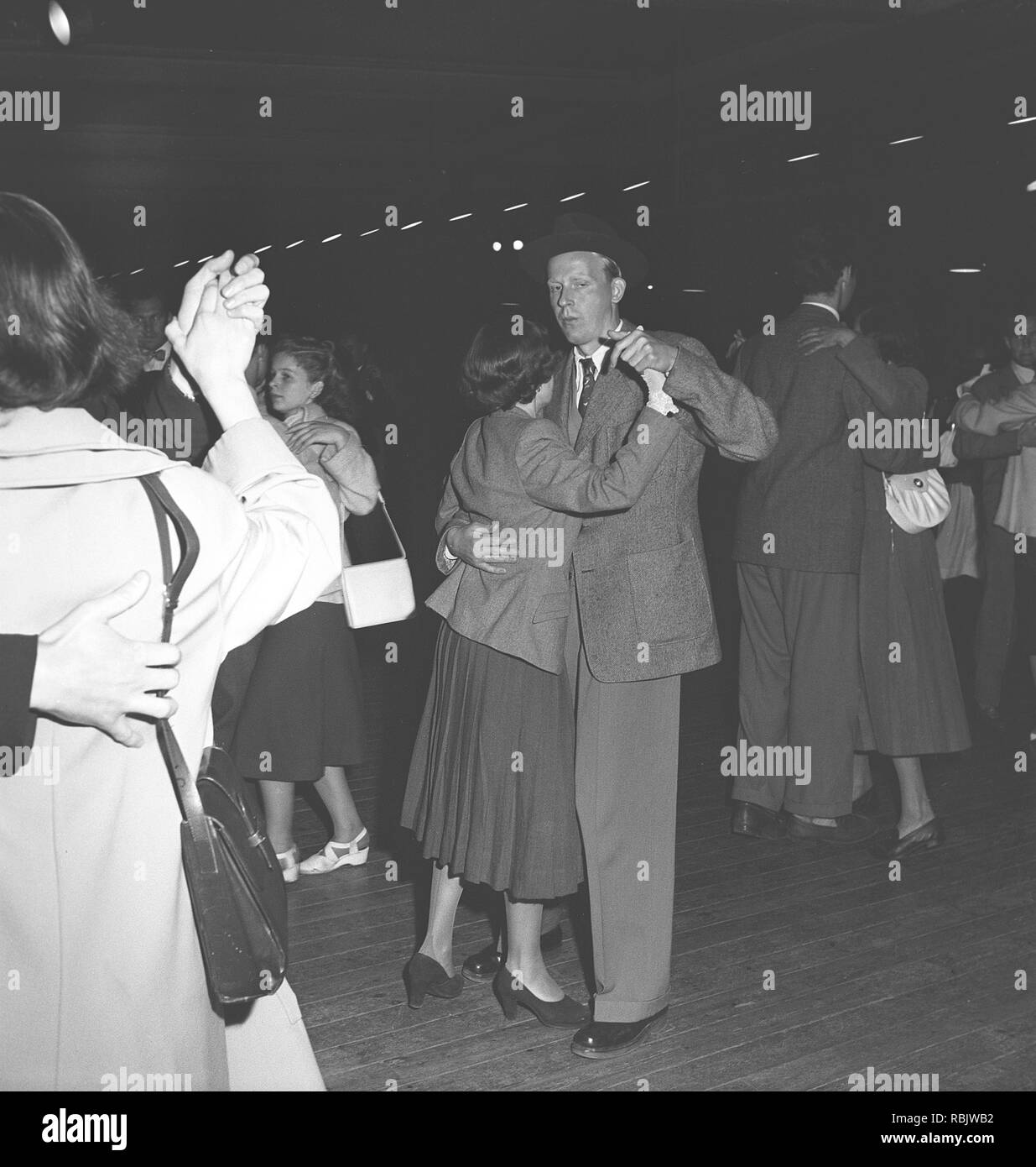 Dancing in the 1940s. A young couple at a dance event is whirling