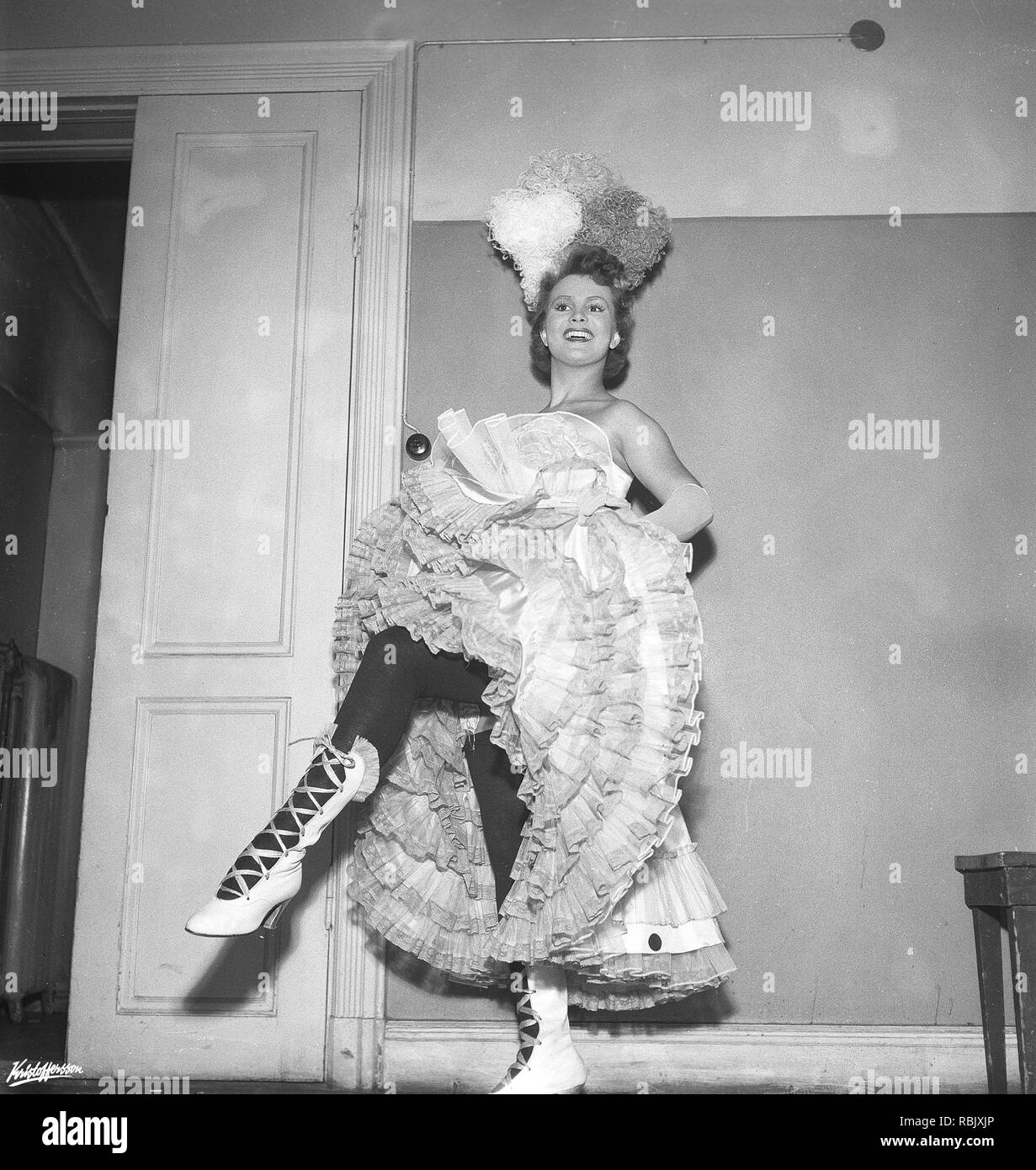 The Can-Can dance. A high-energy, physically demanding dance that became a popular music hall dance in the 1840s, continuing in popularity in French cabaret to this day. The main features of the dance are the vigorous manipulation of skirts and petticoats, along with high kicks, splits and cartwheels. Here a woman dancing the Can-Can in the 1950s. Photo Kristoffersson ref BM106-3 Sweden Stock Photo