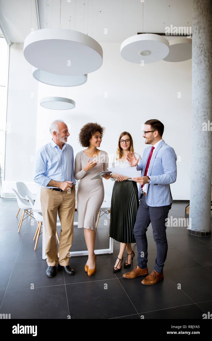 Group of successful business people standing in the modern office Stock ...