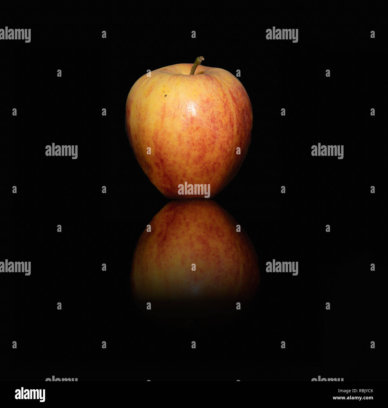 Gala apple and its reflection Stock Photo - Alamy
