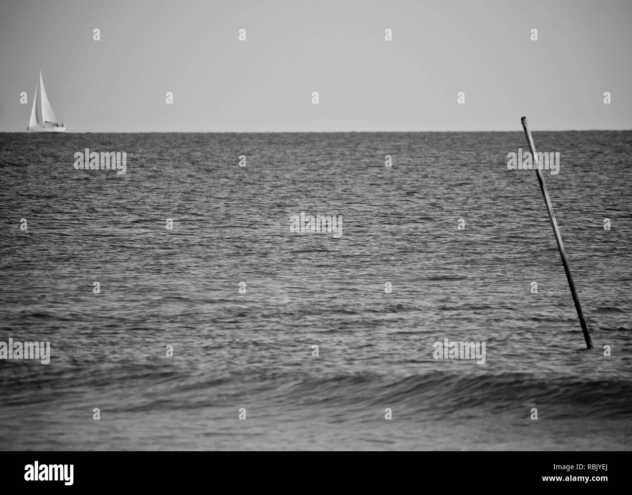 White waves on sandy Black and White Stock Photos & Images - Alamy