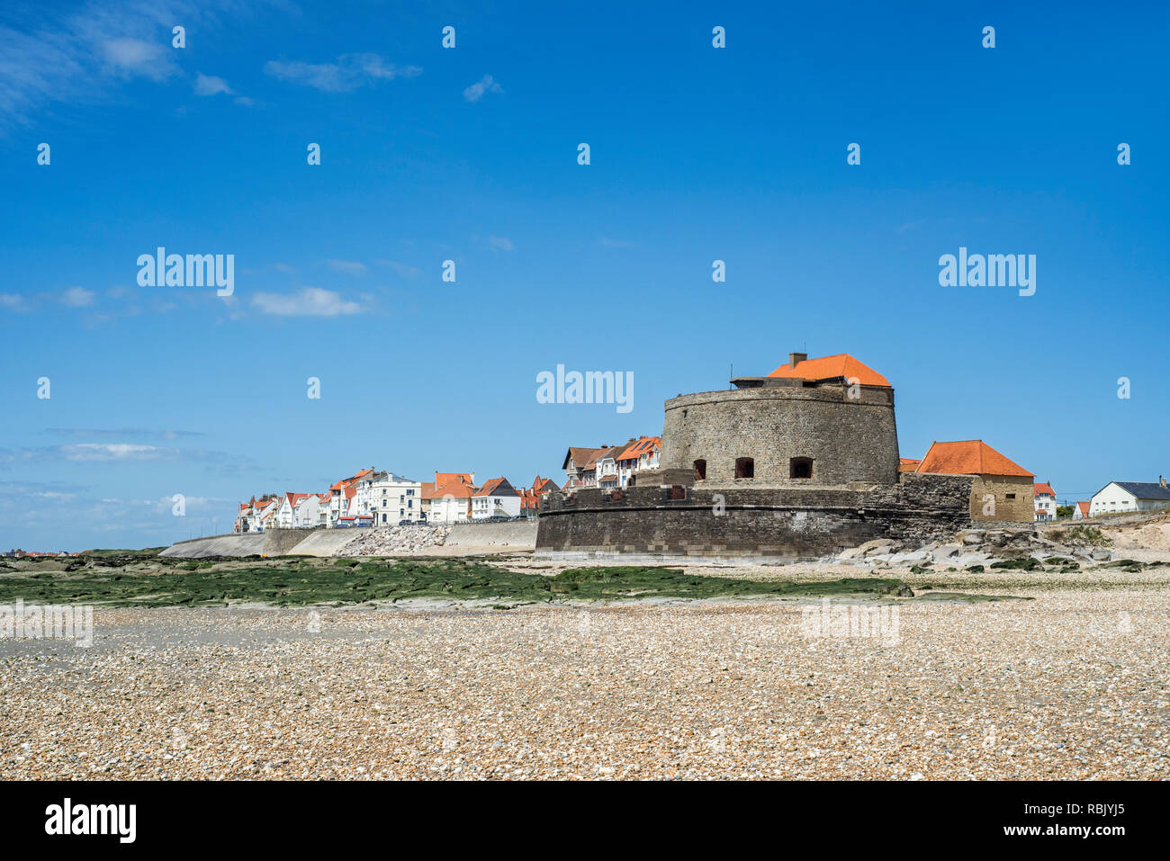 Fort Mahon and shingle beach at low tide at Ambleteuse along rocky North Sea coast, Côte d'Opale / Opal Coast, France Stock Photo