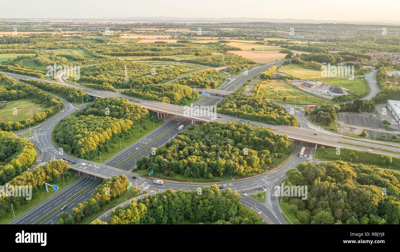 Aerial Image of the Merging of 2 Motorways, M57 and M62 Roundabout near Huyton, Liverpool, England Stock Photo