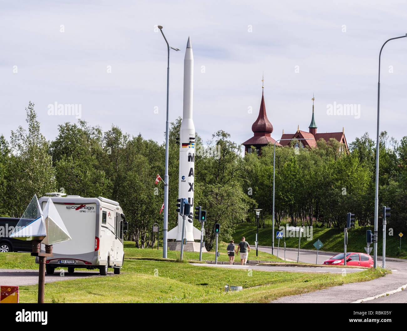 Rocket used in european research program ESA, Kiruna church in the back, park in Kiruna, Sweden Stock Photo