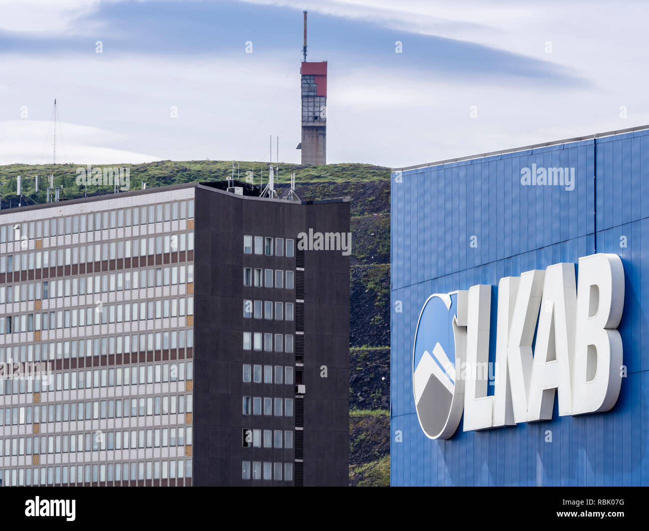 LKAB mining area, large LKAB company sign on building, mining tower in the back, Kiruna, Sweden Stock Photo
