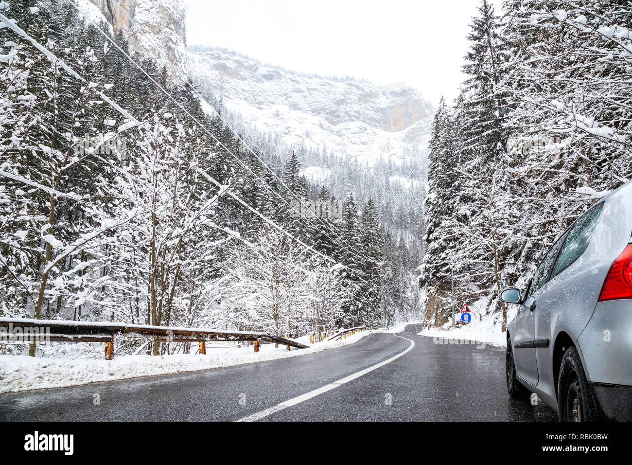 Car in the mountain serpentine in winter. Travel car transport in the winter season Stock Photo
