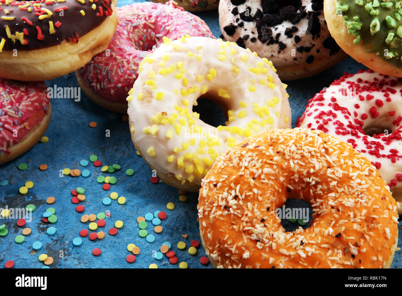 assorted donuts with chocolate frosted, pink glazed and sprinkles ...
