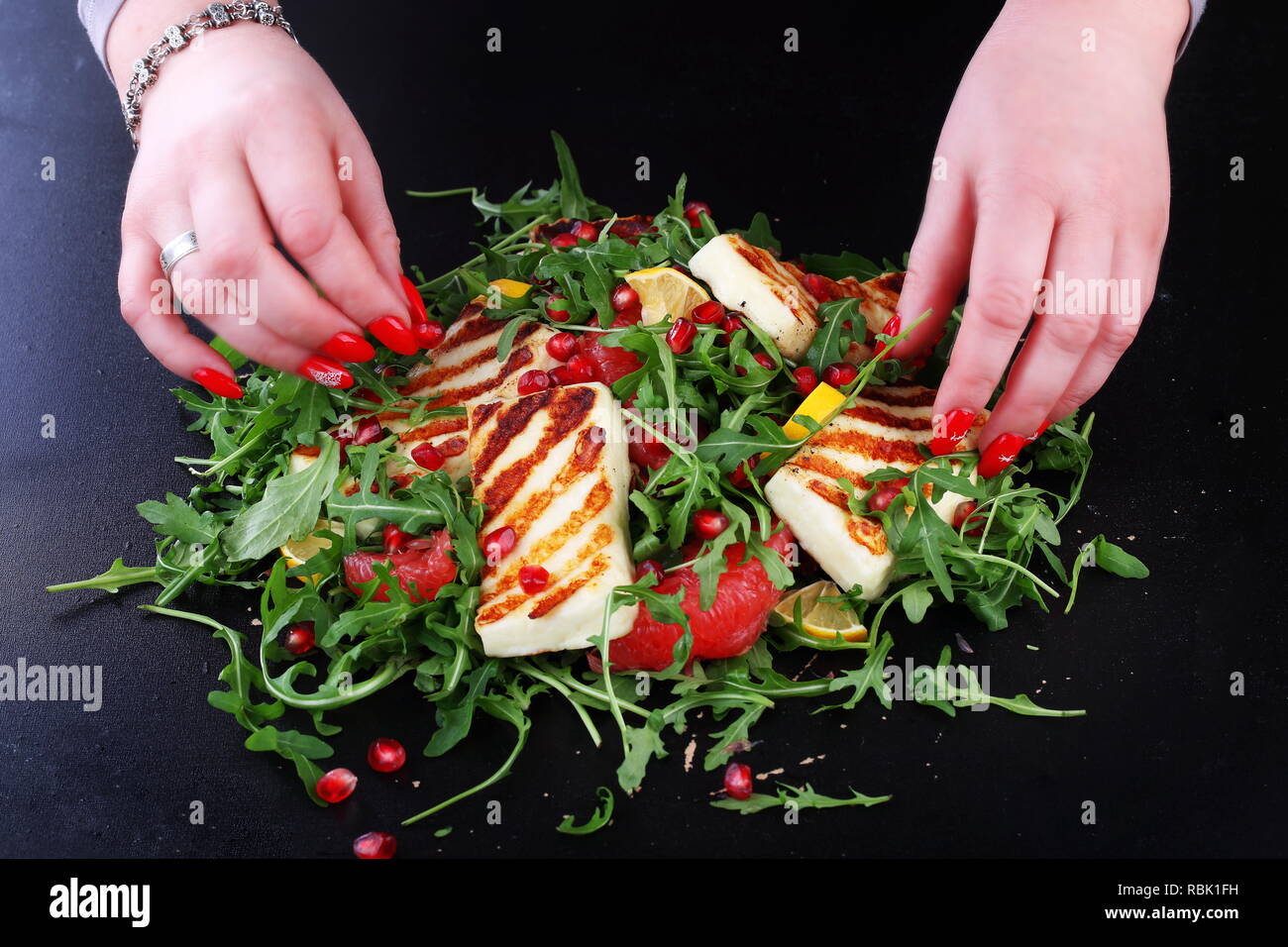 Salad with Halloumi, Pomegranate and Arugula Stock Photo