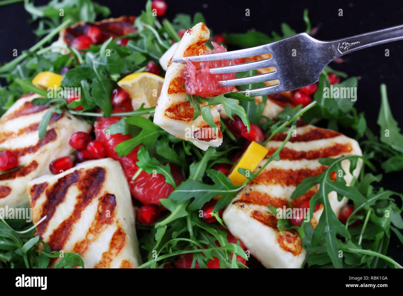 Salad with Halloumi, Pomegranate and Arugula Stock Photo