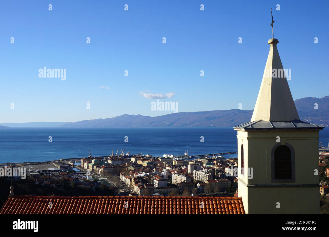 Belfry and roof Church of St. George the Martyr in Croatian town Rijeka, view from above on the town Stock Photo