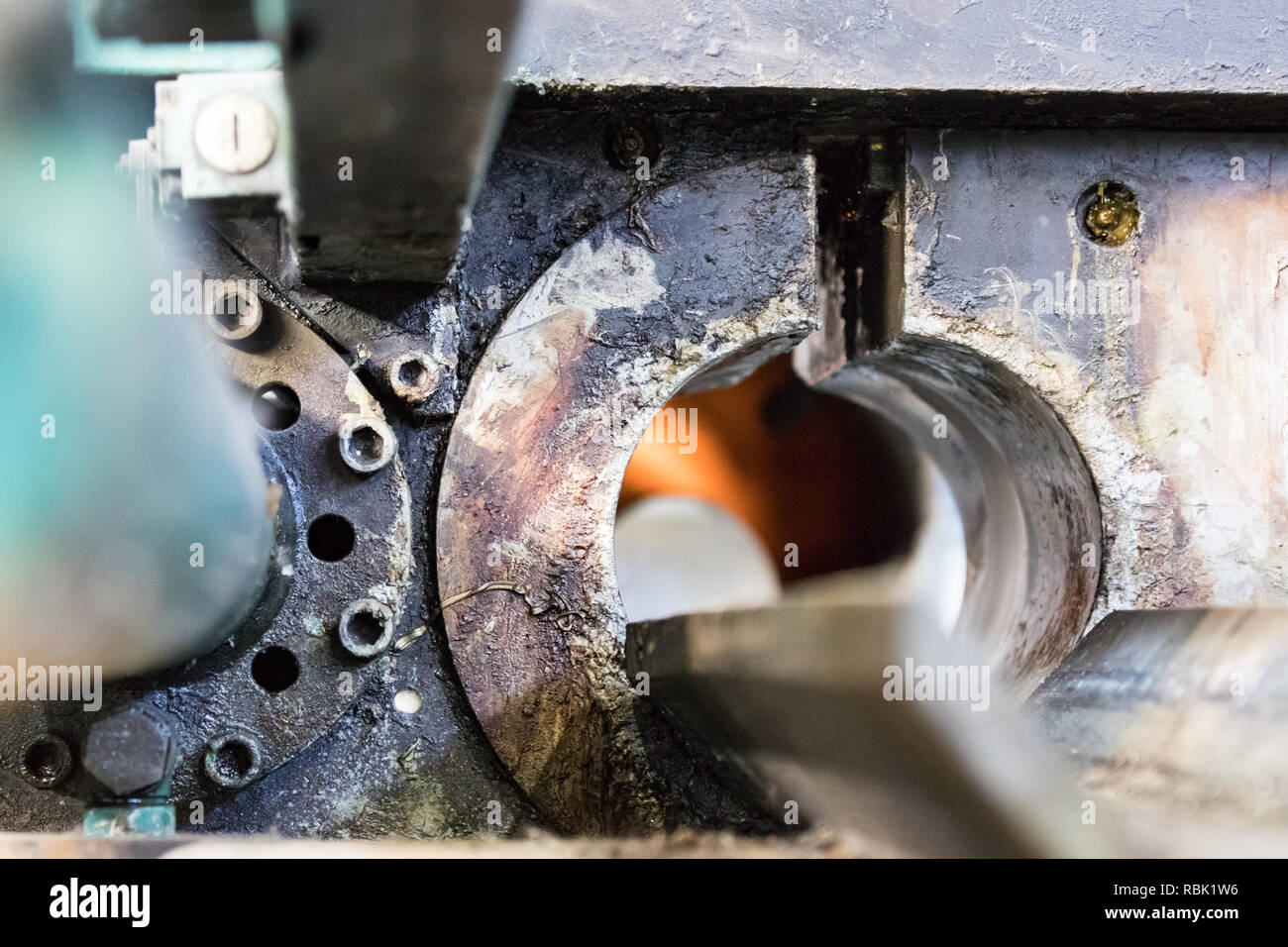 Detail of the entrance of a  aluminium log furnace before the extrusion process Stock Photo