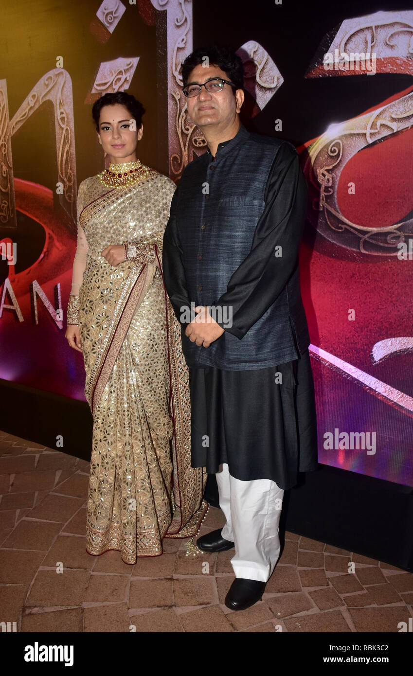 Actress Kangana Ranaut with lyricist Prasoon Joshi are seen during the music launch event of film 'Manikarnika' in Mumbai. Stock Photo