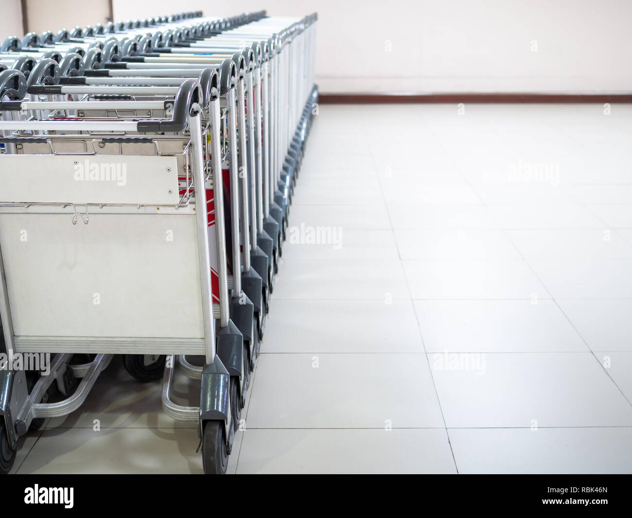 Row of airport luggage carts at the baggage claim in Don Muang