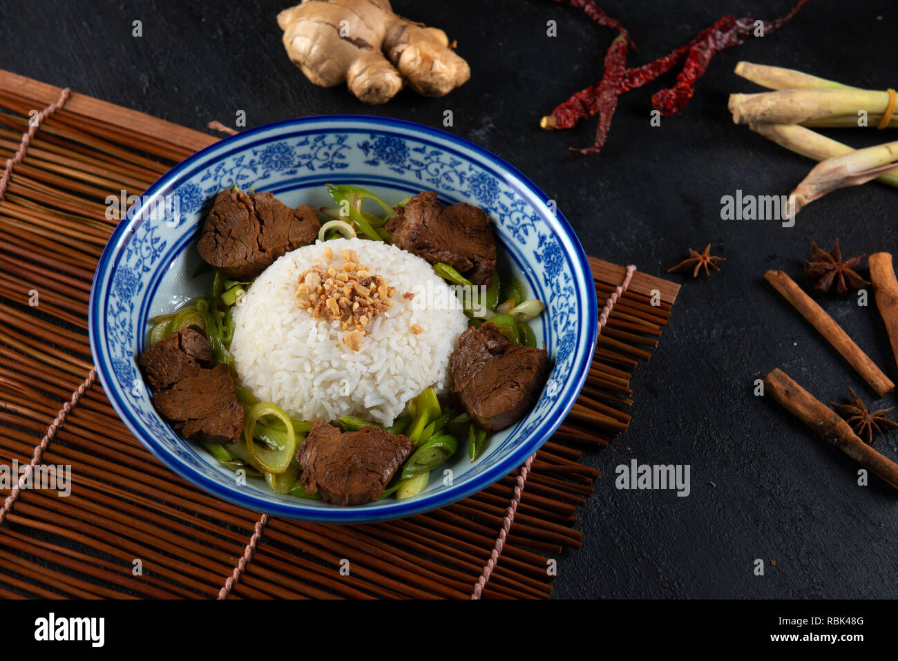 asian style stir fry beef with leek rice Stock Photo Alamy