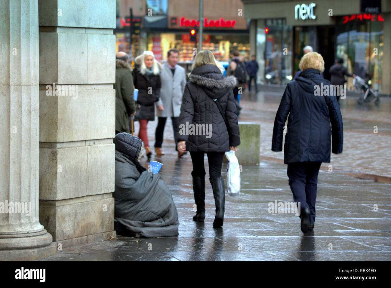 homeless poor person begging unidentifiable on the  Argyle street shopping area  Glasgow scotland uk Stock Photo