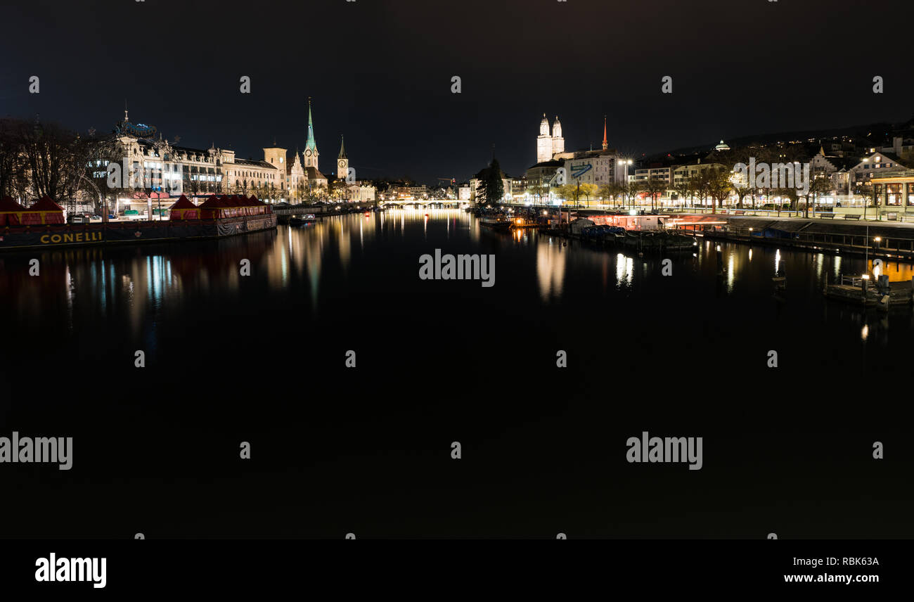 Zurich, ZH / Switzerland - January 4, 2019: night time city skyline view of Zurich with the river Limmat in winter Stock Photo