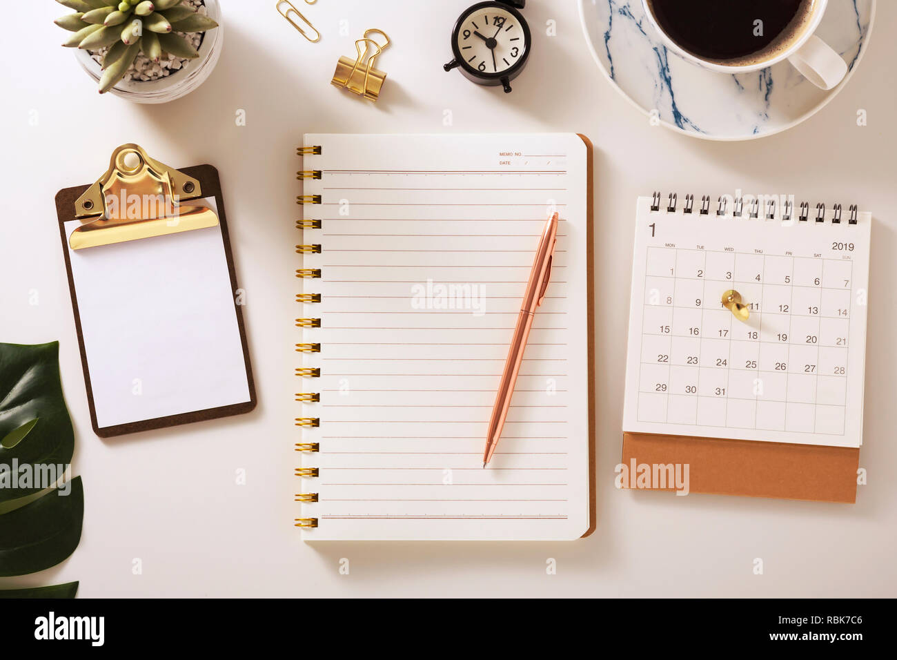 Flat Lay Desk With Notebook Calendar Clipboard And Pen Golden