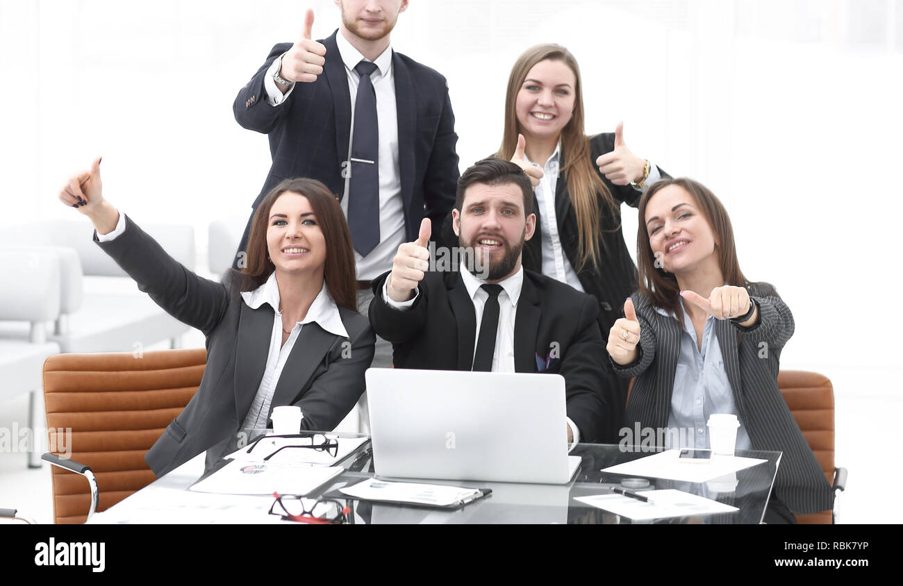 happy professional business team showing thumbs up Stock Photo - Alamy