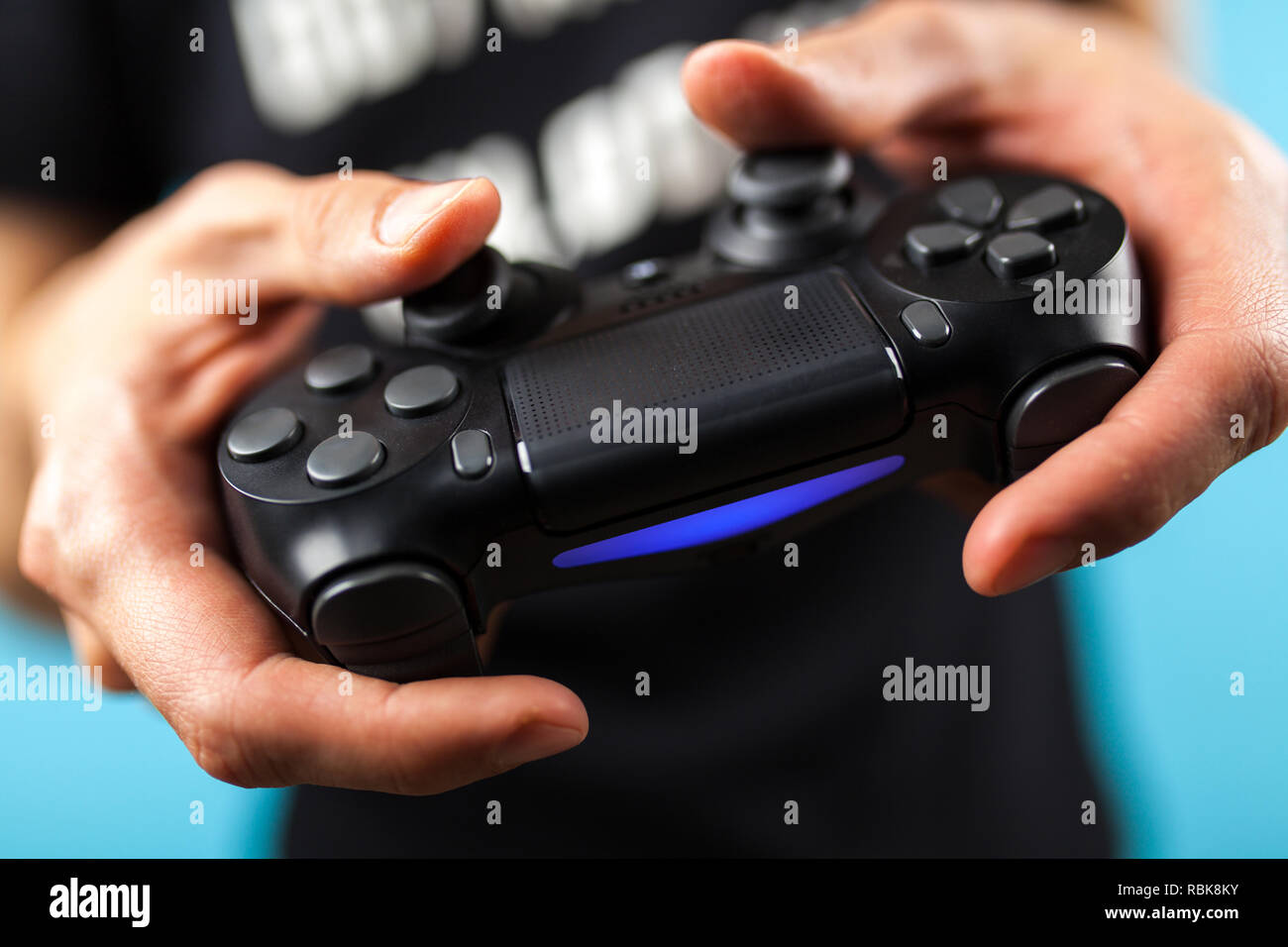 Male hands holding a gaming controller Stock Photo Alamy