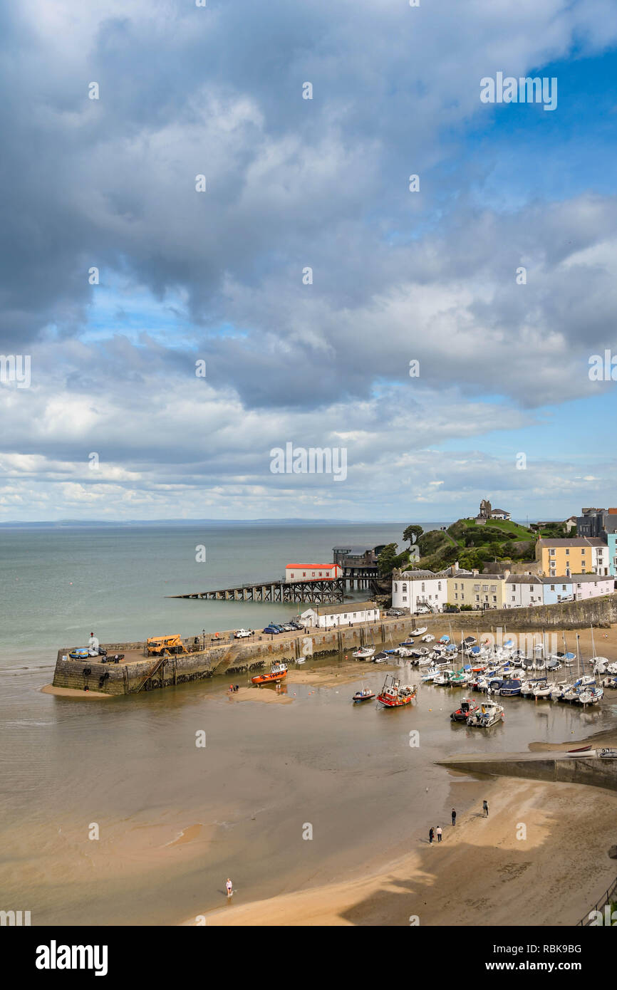 TENBY, PEMBROKESHIRE, WALES - AUGUST 2018: The harbour in Tenby, West Wales as the tide is coming in. Stock Photo