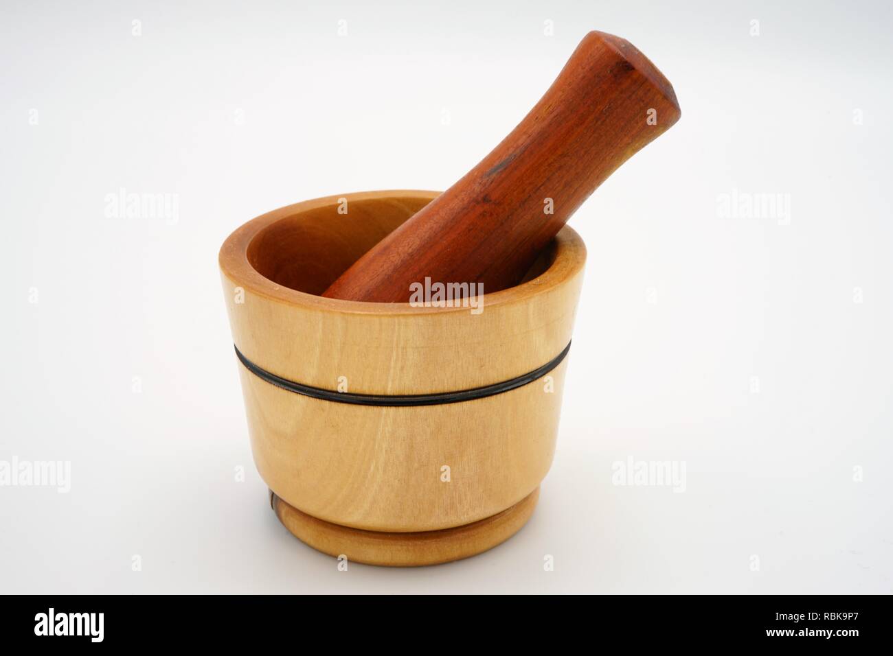 Handmade wooden mortar and pestle isolated on a white background Stock