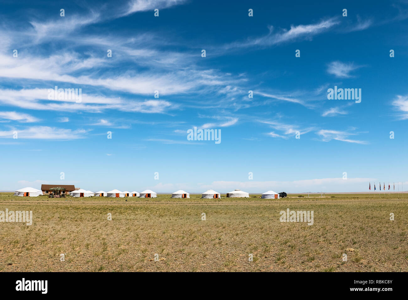 View of Gobi Desert with traditional Mongolian housings / yurts in a tourist camp near Bajandsag (Flaming Cliffs, Gobi Desert, Mongolia, Asia) Stock Photo