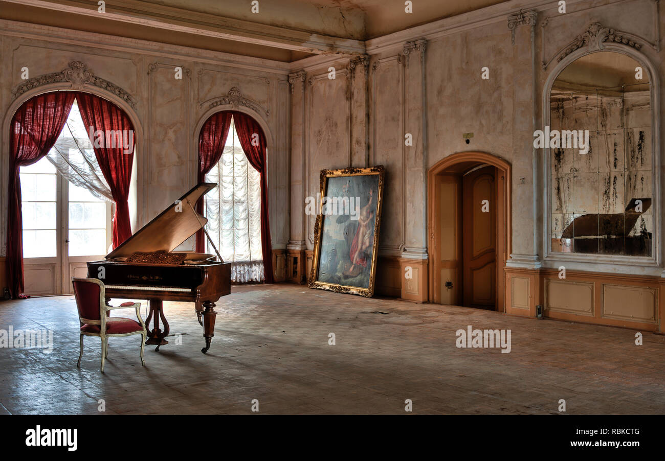 silent piano in an forgotten castle Stock Photo