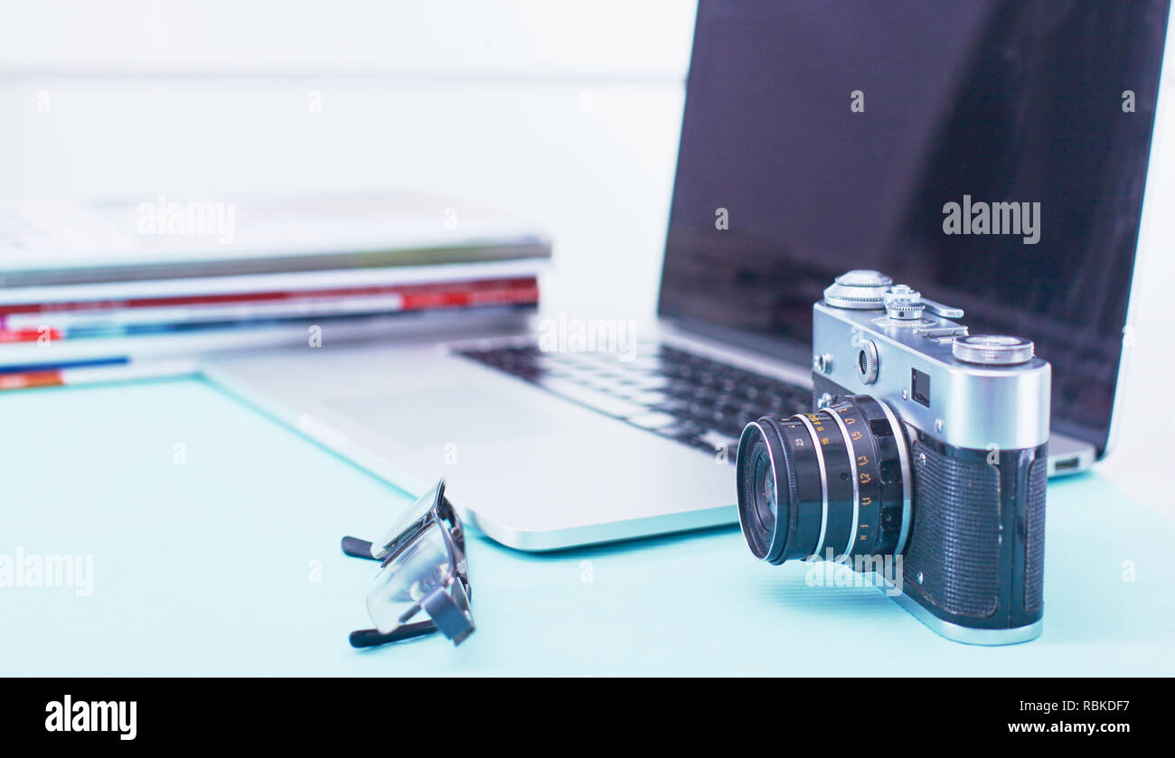 Computer keyboard, mouse and camera lie on table. Stock Photo