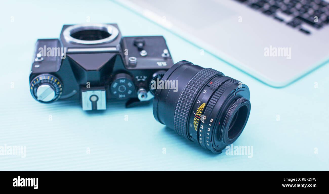 Computer keyboard, mouse and camera lie on table. Stock Photo