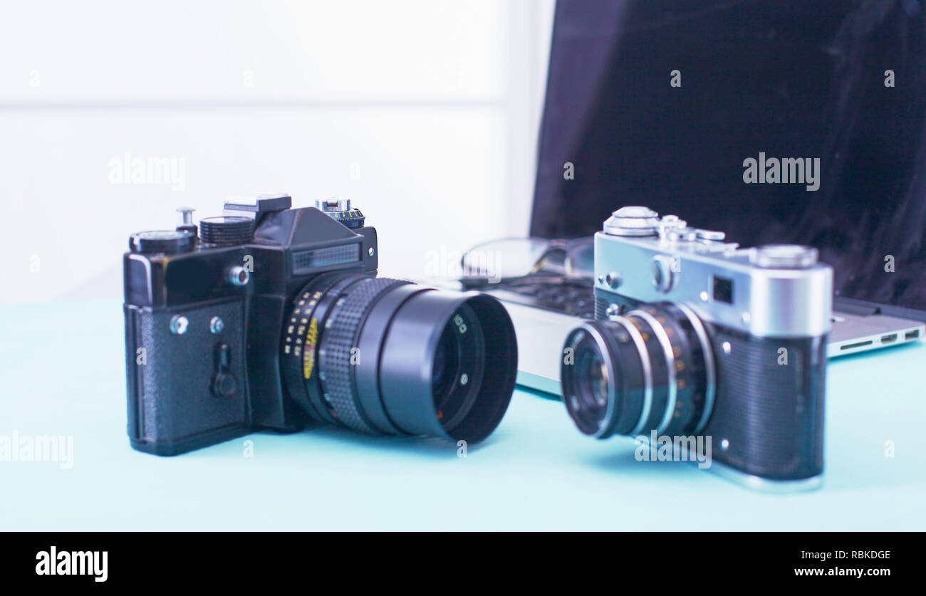 Computer keyboard, mouse and camera lie on table. Stock Photo