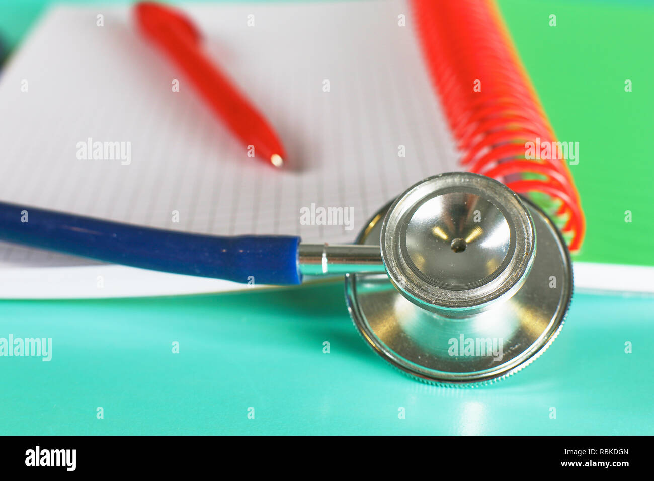 doctor-s-workspace-working-table-with-patient-s-discharge-blank-paper-form-medical-prescription