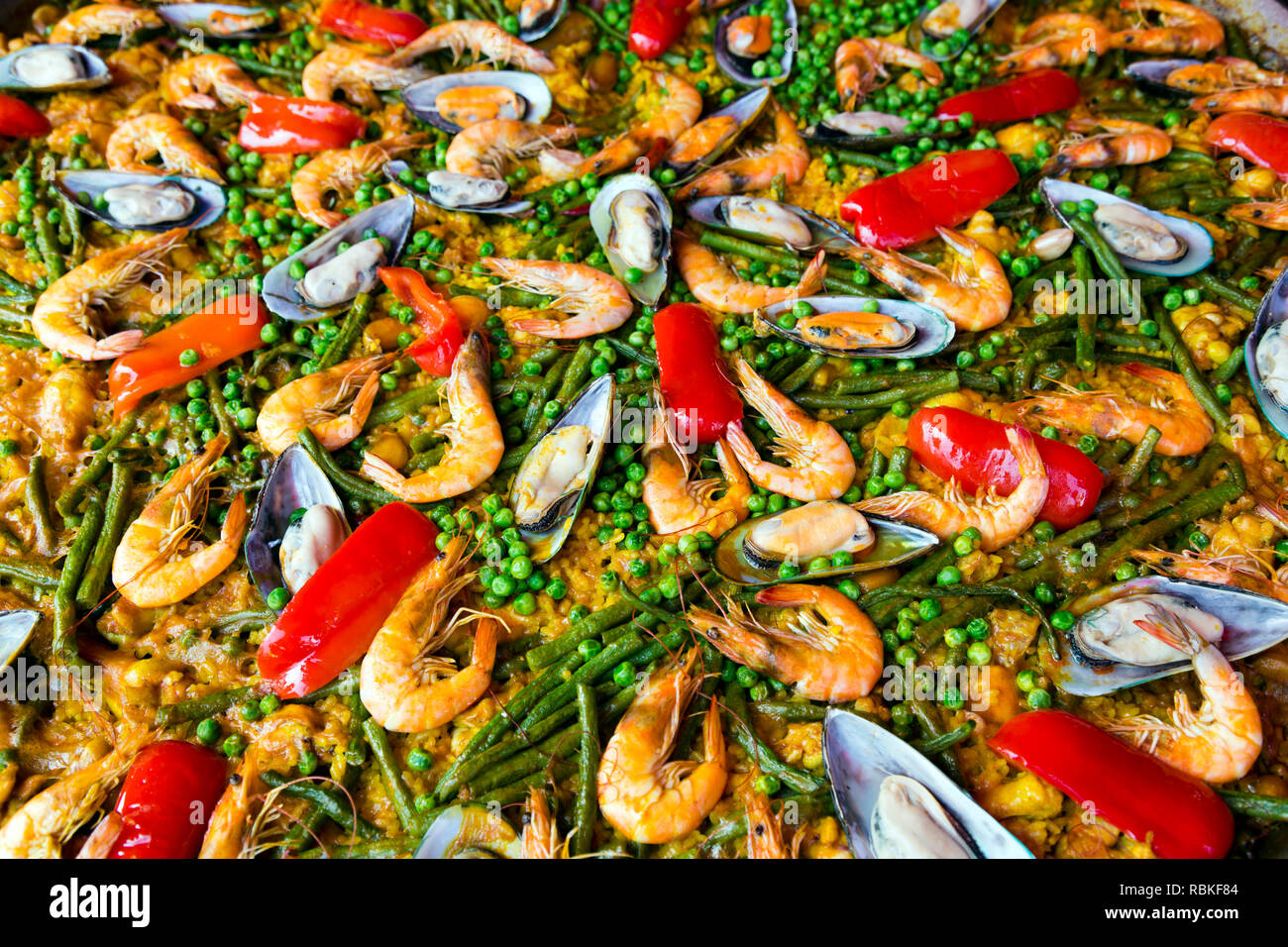 Ingredients cooking in a traditional Spanish paella recipe. Paella is a