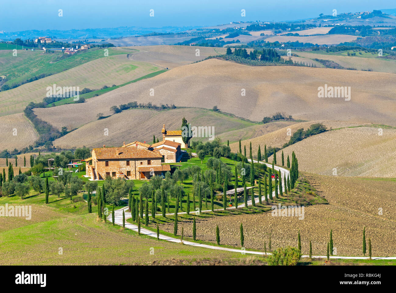 Panoramic overview of rolling farmland and villa Stock Photo - Alamy