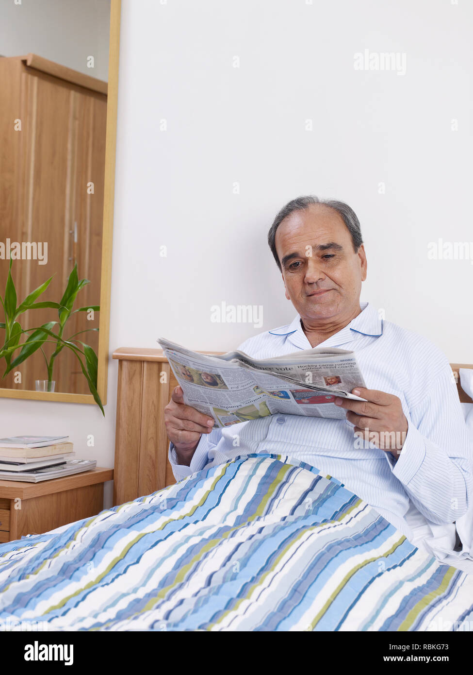Old man sitting on bed hi-res stock photography and images - Alamy