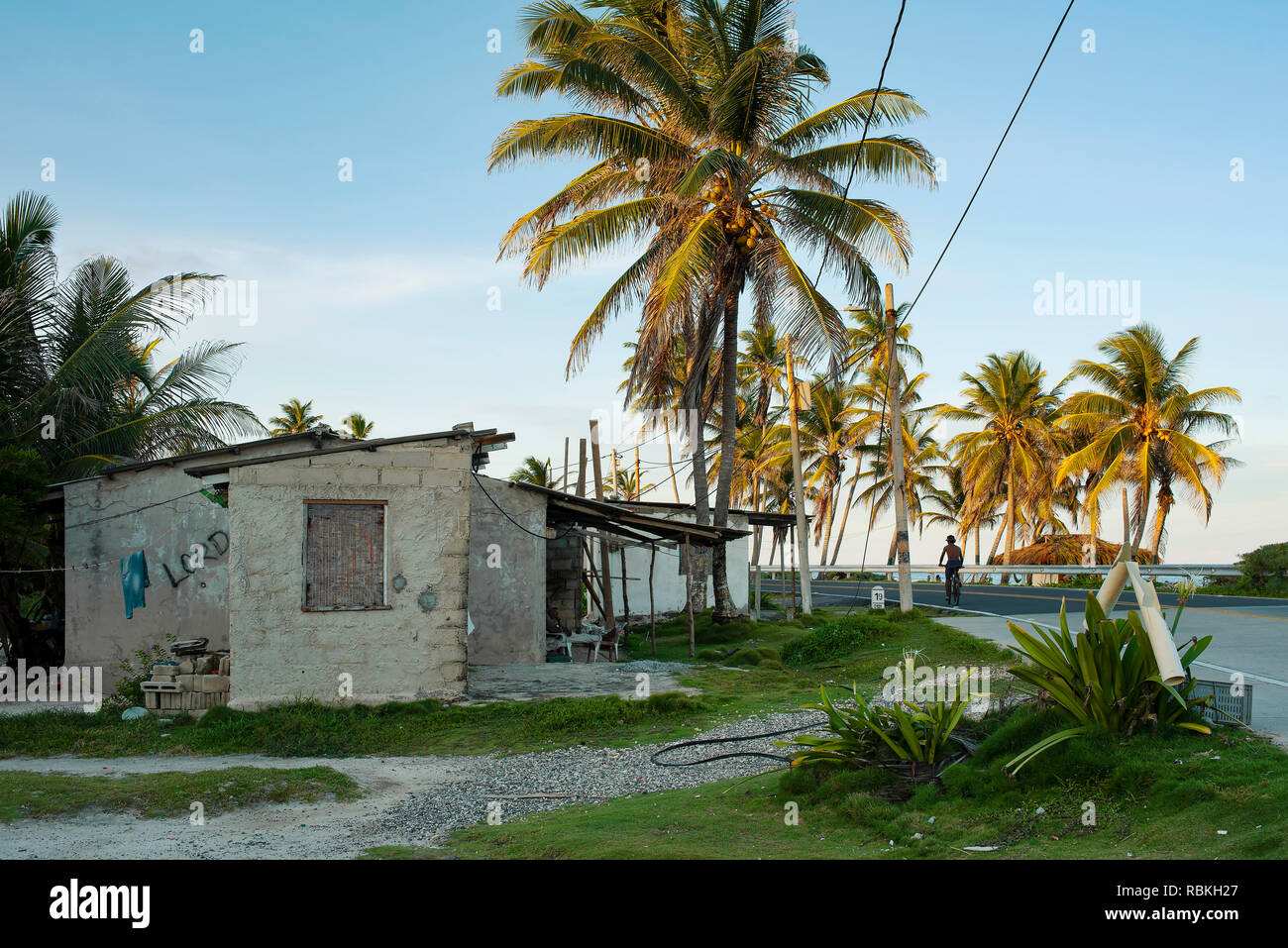 Caribbean residential buildings of lower class settlement along the coastal highway of San Andrés island, Colombia. Oct 2018 Stock Photo