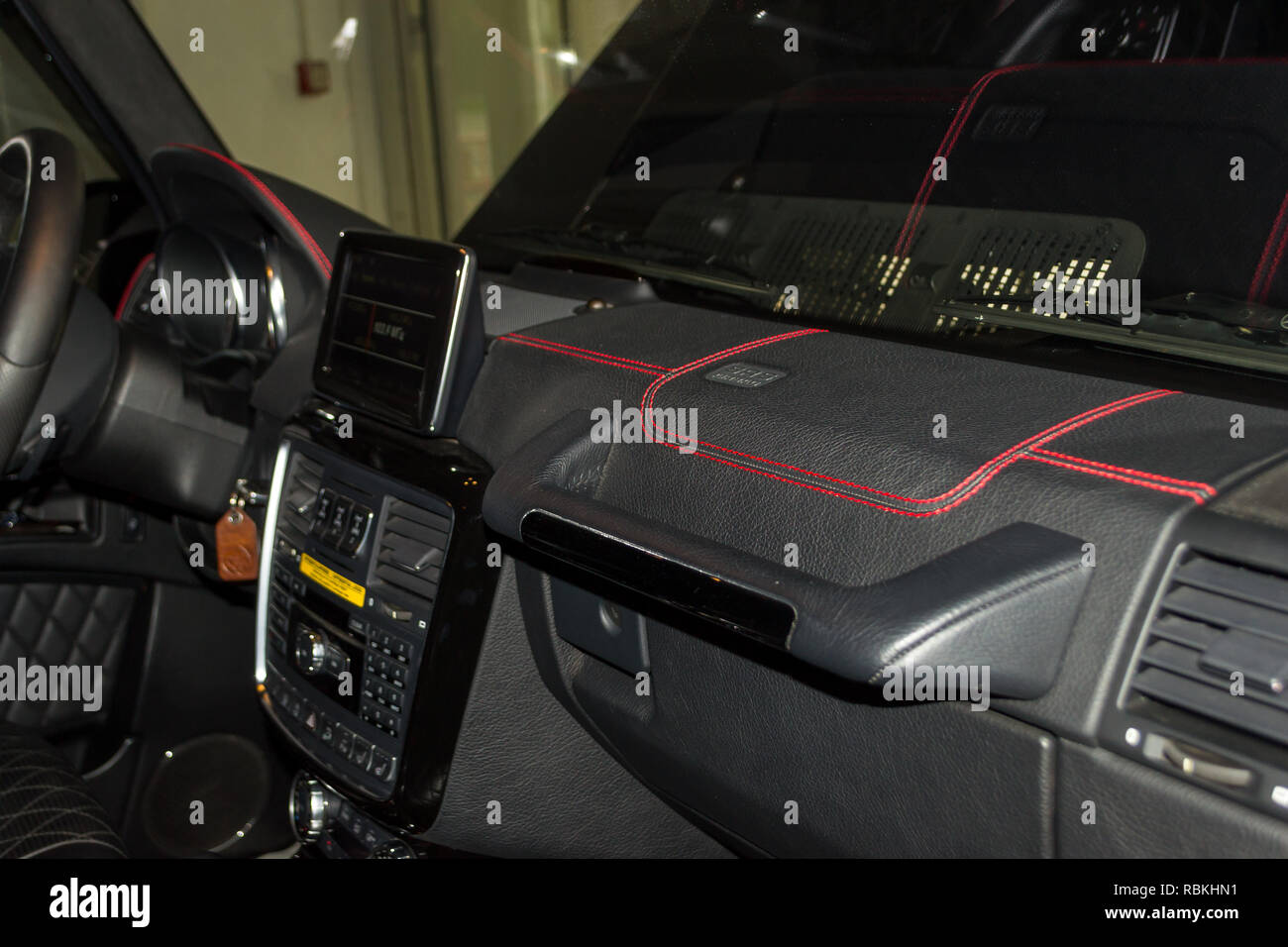 A view of a part of the interior of the car dashboard from leather of