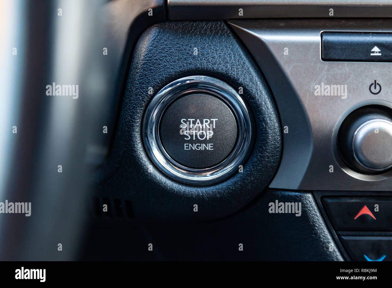 Button start and turn off the ignition of the car engine close-up on ...