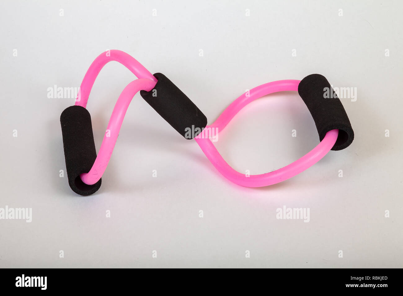 Pink rubber tube expander with black paralon handles for performing