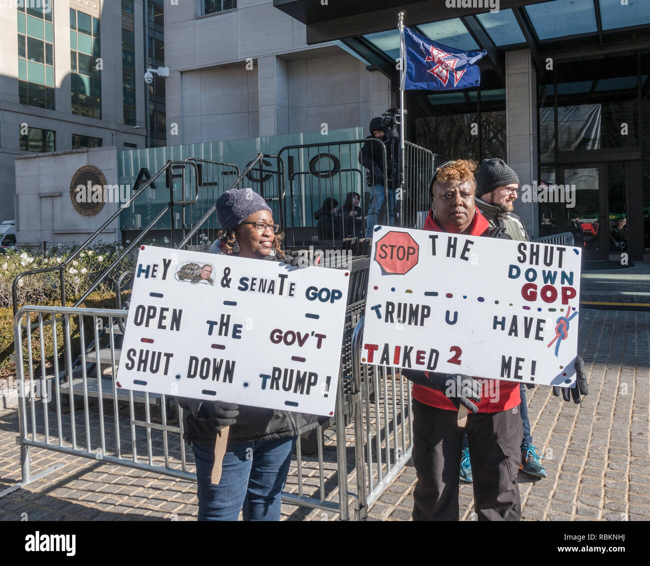 Washington, DC, USA.  10th January, 2019. Protesting the partial government shutdown, hundreds of furloughed as well as unpaid working federal employees, and supporters rallied outside the AFL-CIO headquarters, where they heard from union leaders and members of congress calling for President Trump and Republican senate majority leader Mitch McConnell to end the shutdown. A march to the nearby White House followed. Bob Korn/Alamy Live News Stock Photo