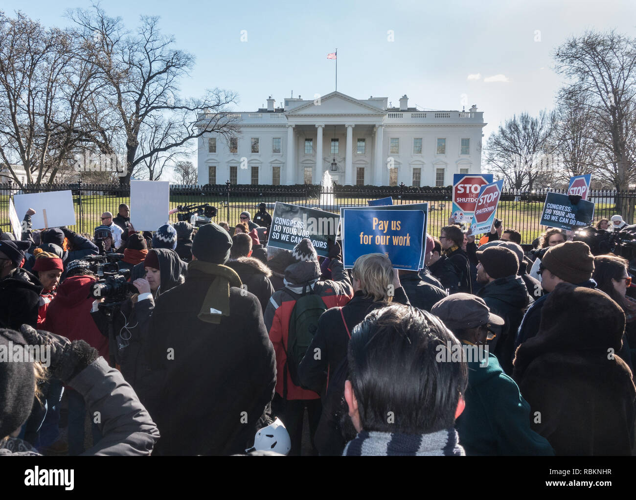 Washington, DC, USA.  10th January, 2019. Protesting the partial government shutdown, hundreds of furloughed as well as unpaid working federal employees, and supporters marched to the White House after a rally outside the nearby AFL-CIO headquarters, where they heard from union leaders and members of congress calling for President Trump and Republican senate majority leader Mitch McConnell to end the shutdown. Bob Korn/Alamy Live News Stock Photo