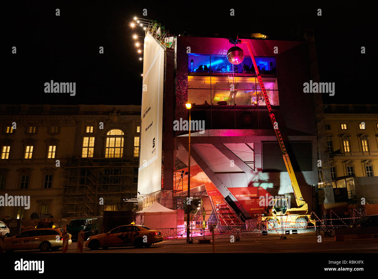 10 January 2019, Berlin: In front of the Humboldt Box stands a mobile crane with a huge disco ball. The guests of the nightly 'demolition party' can celebrate and dance in the box for the last time. Soon it will be torn down. Photo: Annette Riedl/dpa-Zentralbild/ZB Stock Photo