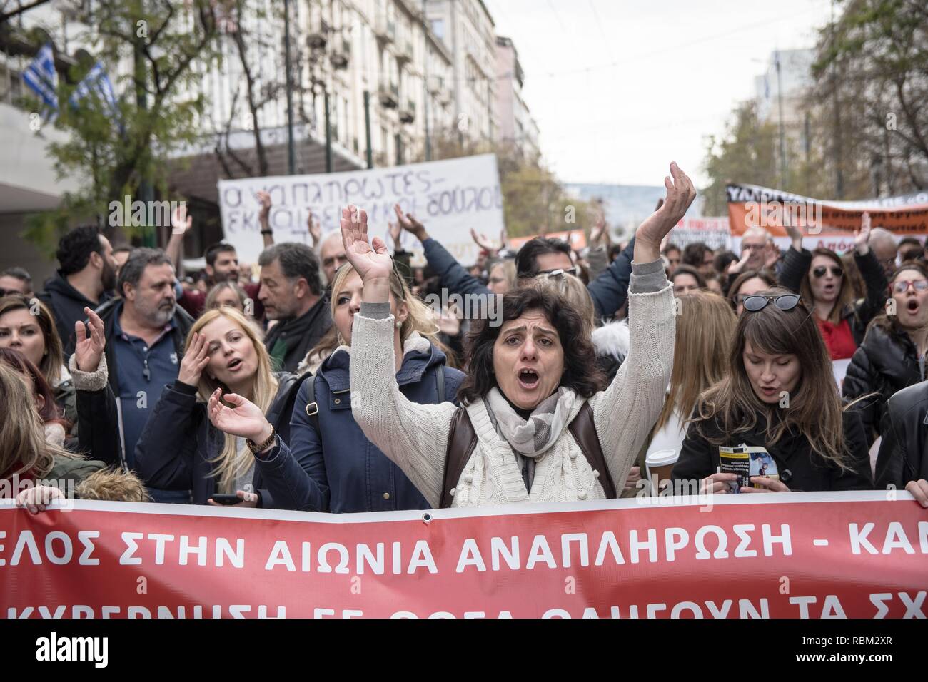 Athens, Greece. 11th Jan, 2019. Protesters are seen holding a banner while chanting slogans during the demonstration.Thousands of people protest to withdraw the Ministry of Education's plan on the new system of the 15,000 recruits. Credit: Nikolas Joao Kokovlis/SOPA Images/ZUMA Wire/Alamy Live News Stock Photo