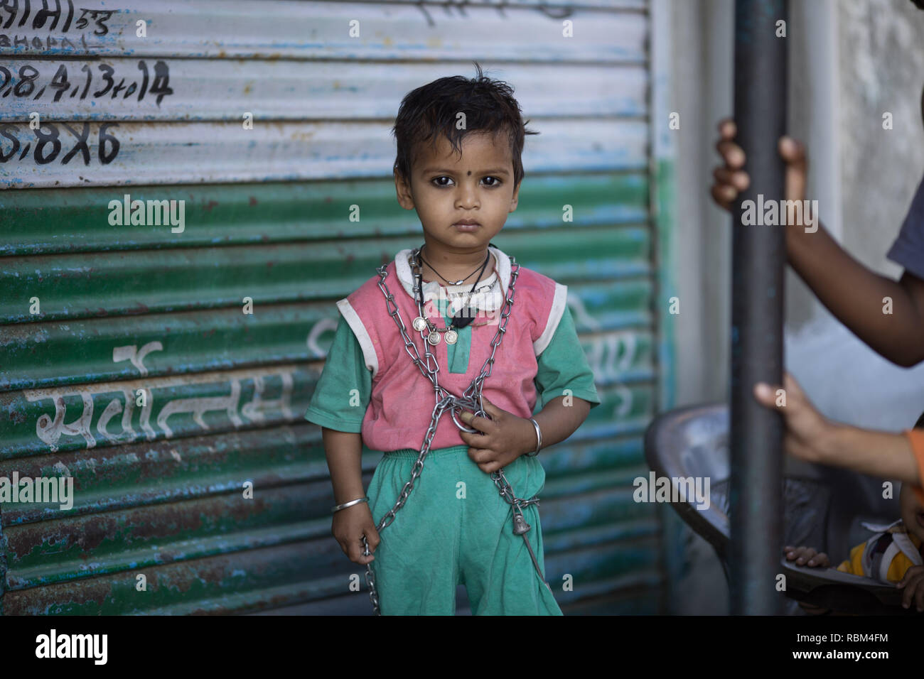 India. 13th Mar, 2017. A local child seen posing for a photo near the derelict Union Carbide factory, Bhopal.The Bhopal Gas Disaster was a gas leak incident on the night of 2-3 December 1984 at the Union Carbide plant in Bhopal. Over 500,000 people were exposed to the toxic methyl isocyanate (MIC) gas as they slept. The final death toll is estimated to be between 15,000 and 20,000. Credit: Ryan Ashcroft/SOPA Images/ZUMA Wire/Alamy Live News Stock Photo