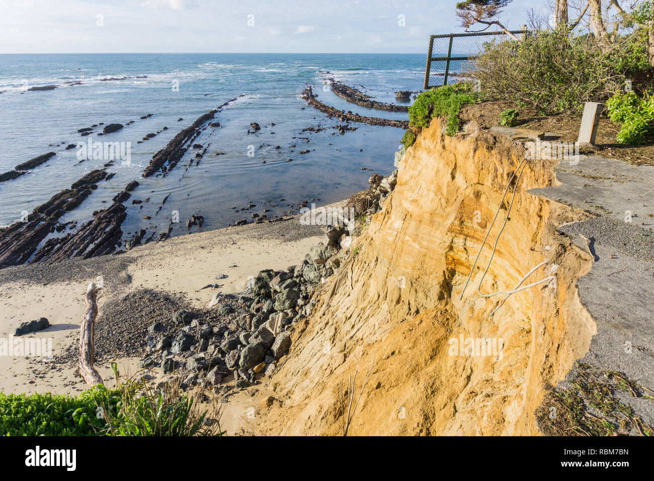 Collapsed paved road due to a landslide on the Pacific Ocean coastline, Moss Beach California Stock Photo