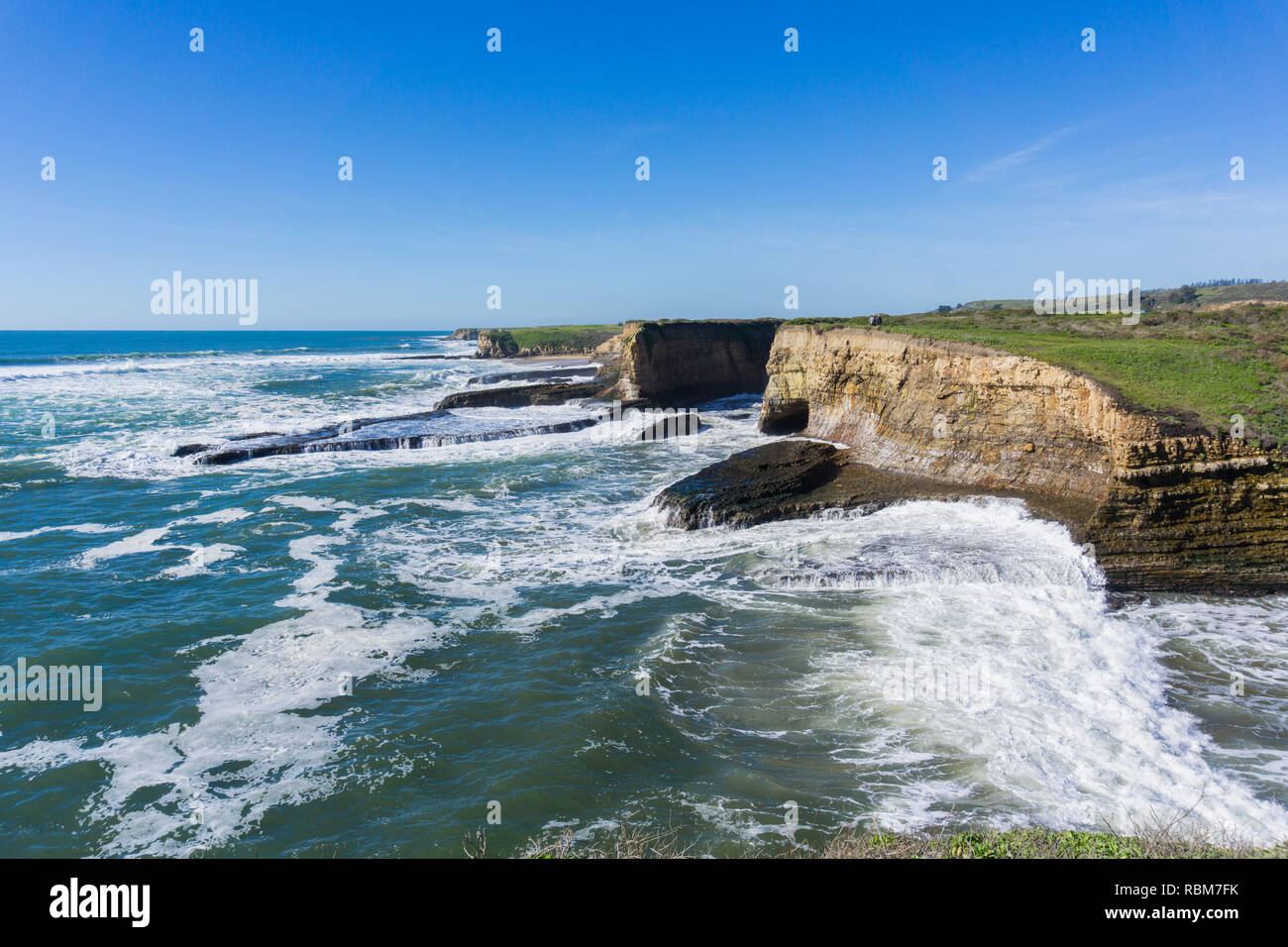Dramatic landscape of the Pacific Ocean Coast during high tide and strong surf, Wilder Ranch State Park, California Stock Photo